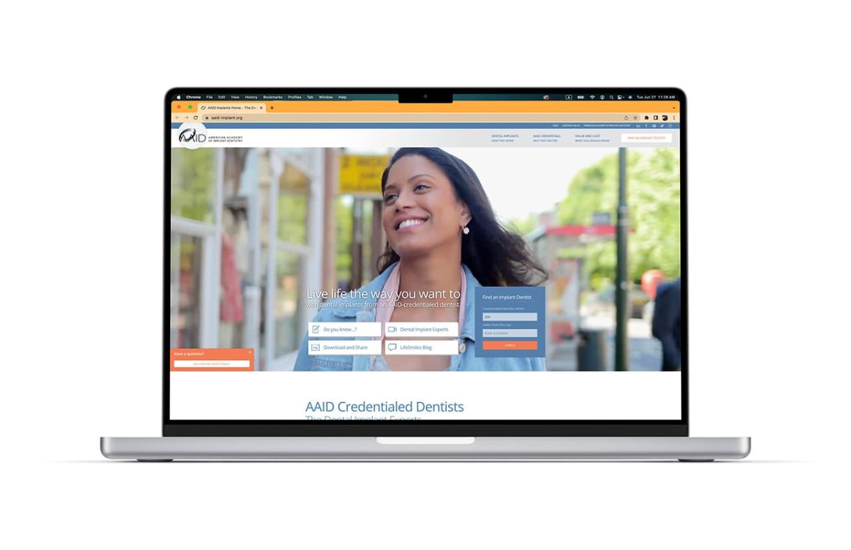 mock up of AAID homepage shown on a laptop showcasing neigerdesign's website redesign expertise